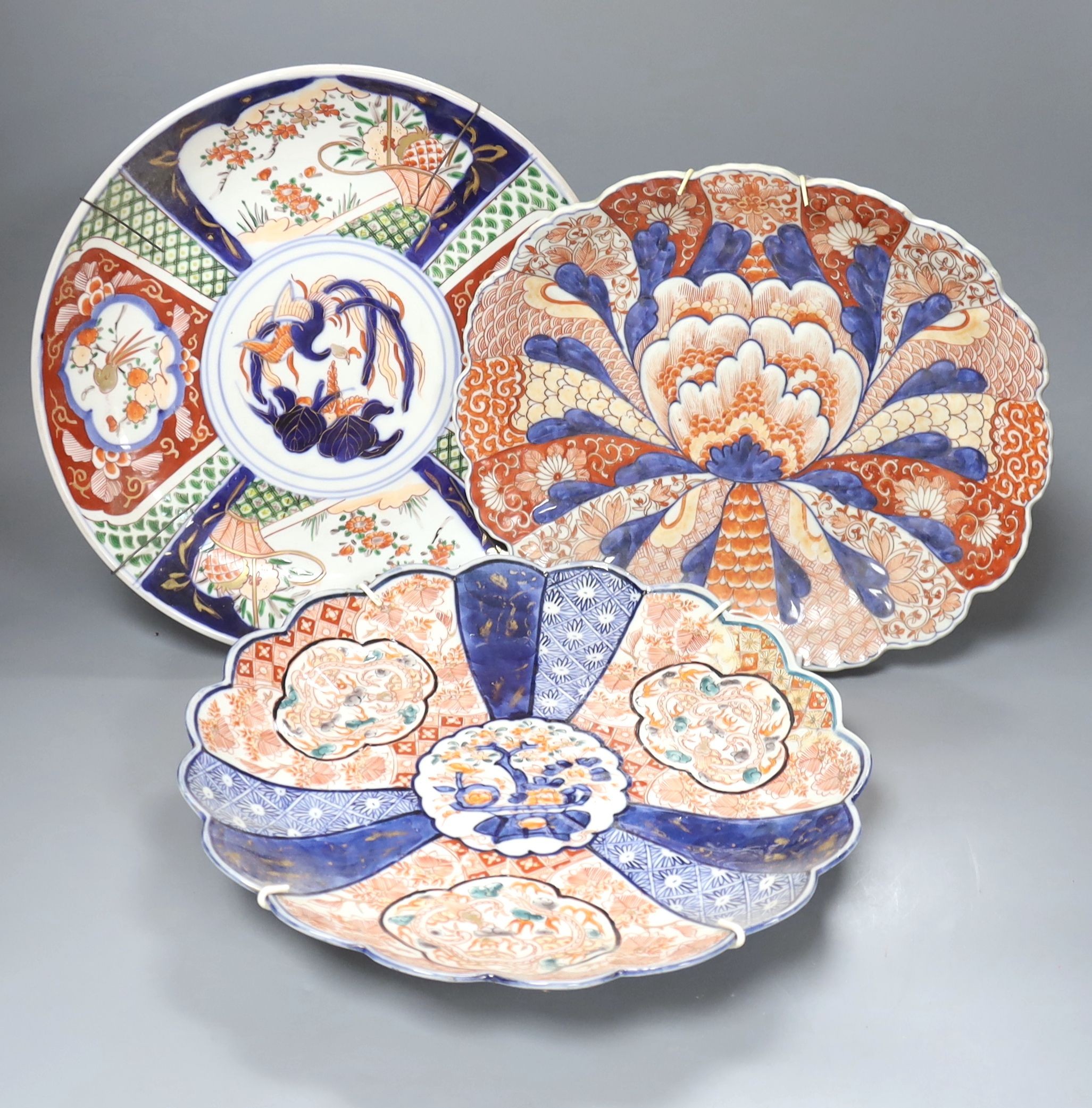 Seven various Japanese Imari dishes, late 19th century, 29.5 to 30.5cm wide